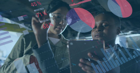 Analyzing data two women wearing pale shirt, dark shirt at data lab, with tablet, hologram charts. Futuristic, teamwork, innovation, digital, biometric, technological, professionalの写真素材