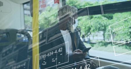 Commuter in face mask, suit jacket using smartphone on train by window, with data overlays. Urban, technology, professional, modern, transportation, connectivity, dataの写真素材
