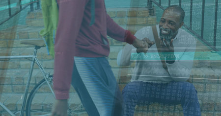 Smiling man bumping fists with passing athlete on street corner steps, with bicycle, green backpack. Urban, friendship, casual, active, outdoor, community, vibrantの写真素材