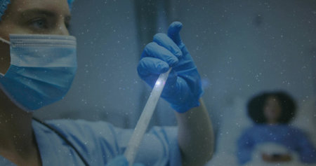 Globe of digital icons spinning against digital interface with data processing on black backgroundの写真素材