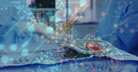 Surgeons in blue scrubs arranging forceps on steel tray in operating room with digital overlay....