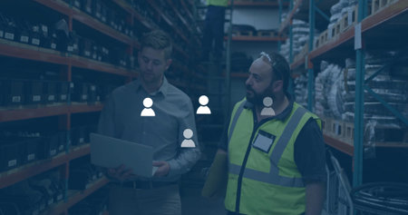 Three workers in safety gear retrieving stock on ladder in storage aisle, with laptop and documents. Industrial, logistics, organization, teamwork, efficiency, structured, vibrantの写真素材