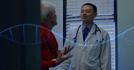 Consulting doctor and patient in clinic, window blinds, stethoscope, digital double helix overlay. Healthcare, diagnosis, medical, genetics, innovation, professionalism, communicationの写真素材