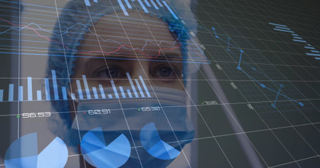 Nurse wearing surgical cap mask and scrubs interpreting charts in medical lab, glass data overlay. Medical, technology, analysis, futuristic, healthcare, research, clinicalの写真素材