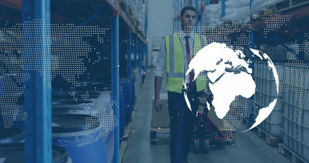 Walking man in safety vest moving down warehouse aisle, with blue drums and world map overlay....