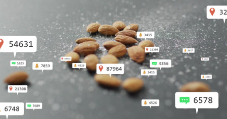 Displaying whole almonds floating at kitchen counter, with coarse salt crystals and overlay icons. Tech, digital, modern, minimal, health, culinary, communicationの写真素材