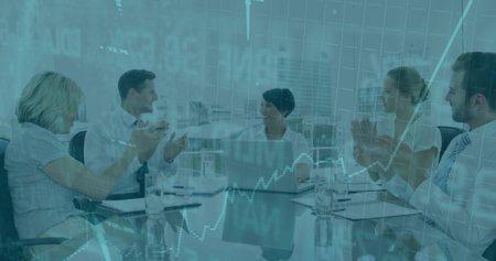 Clapping professionals sitting in business attire around table in boardroom, with laptop and charts. Corporate, teamwork, innovation, strategy, success, leadership, modernの写真素材