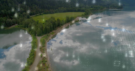 Traversing winding unpaved road along lake shoreline overhead in lakeside area, with binary code....