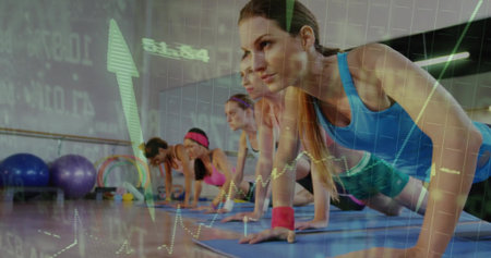 Woman in blue tank top planking on blue mats in gym, with chart overlay, copy space. Fitness, strength, wellness, training, athleticism, teamwork, vibrantの写真素材