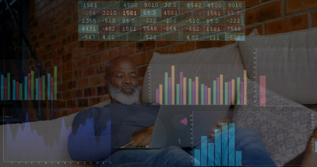 Reviewing financial charts older man examining data on laptop in living room, with chart overlay....