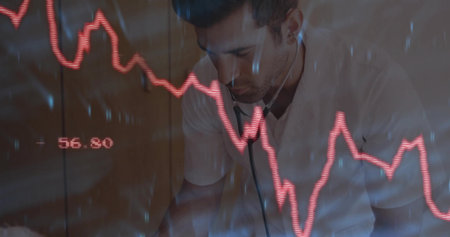Leaning forward doctor examining red digital graph in clinic room with stethoscope and cabinets. Medical, healthcare, analysis, diagnostics, clinical, professional, dataの写真素材