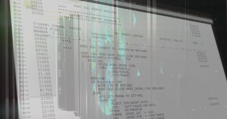 Showing computer monitor displaying SQL database commands in data center, with rack reflections....
