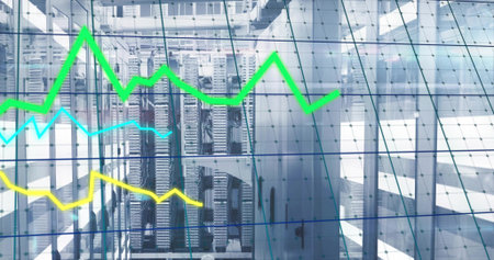 Showing server racks displaying performance data in data center corridor, with line graph overlay....