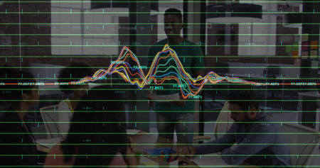 Presenting man wearing green shirt explaining data graphs in meeting room with printed charts. Collaboration, teamwork, analytics, corporate, modern, innovation, brainstormingの写真素材