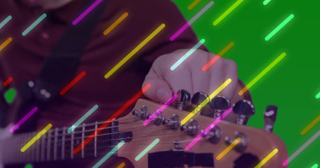 Tuning man adjusting tuning pegs on guitar headstock in studio, with neon streaks, copy space. Musician, music, performance, technology, creativity, vibrant, modernの写真素材