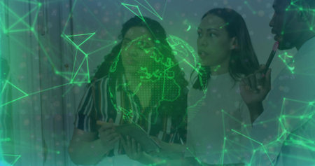 Examining three-person team analyzing digital globe network overlay in boardroom with tablet stylus. Technology, collaboration, innovation, futuristic, data visualization, corporate, teamworkの写真素材