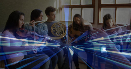 Conductor's baton directing six musicians playing violin, flutes, horn and guitar in studio....