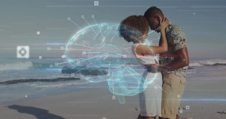 Embracing couple standing on shoreline, in dress and shirt, with 3D brain projection with UI icons. Romance, connection, tranquility, technology, communication, intimacy, wellnessの写真素材
