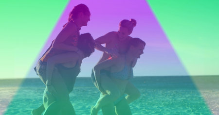 Four friends wearing colorful swimsuits giving piggyback rides on sandy beach, with ocean horizon. Vacation, leisure, relaxation, outdoors, playful, camaraderie, vibrantの写真素材