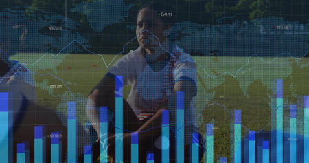 Lacing kneeling soccer player lacing cleat on grass field, with cones, shin guards and data overlay. Athletic, teamwork, performance, outdoor, vibrant, fitness, analysisの写真素材