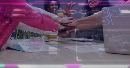 Professional team of five placing hands together in office meeting room, with data overlays....