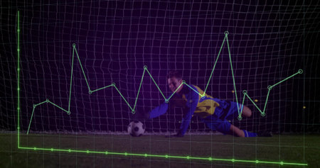 Saving focused goalkeeper diving low on stadium pitch at night, with overlaid green data graph. Athlete, sports, minimalist, data, performance, outdoor, competitiveの写真素材