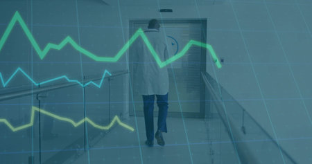 Walking doctor wearing white lab coat and trousers in hospital corridor, with digital graph overlay....