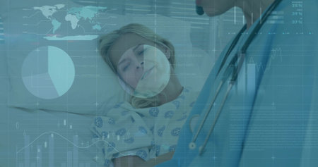Doctor leaning over patient in hospital bed, with stethoscope, patterned gown and data graphics. Medical, healthcare, diagnostic, digital, analysis, clinical, modernの写真素材