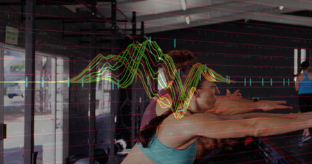 Girl in white tee turning pages at library table showing animated icons with educational overlaysの写真素材