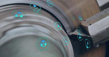 Cutting carbide insert engaging spinning metal cylinder on shop floor, showing teal digital icons. Manufacturing, precision, industrial, technology, automation, innovation, engineeringの写真素材