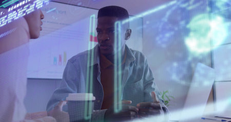 Gesturing business professional presenting charts in meeting room, with laptop and data overlay. Collaboration, innovation, analytics, corporate, technology, teamwork, modernの写真素材