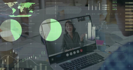 Laptop screen showing Asian woman gesturing in office, with interface icons notebooks pens overlays....