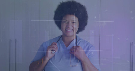 Smiling nurse in blue scrubs holding stethoscope earpieces in clinic room, with numeric overlay. Medical, healthcare, professional, clinical, diagnostics, technology, wellnessの写真素材