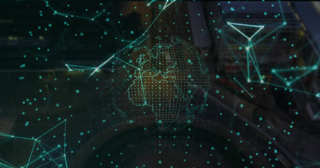 Hologram globe floating in workspace, with continent outlines in network mesh and blurry consoles. Digital, technology, innovation, futuristic, connectivity, network, abstractの写真素材