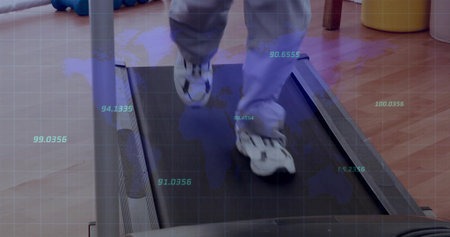 Walking adult wearing grey exercise pants and white shoes on treadmill in gym, with data overlay. Fitness, rehabilitation, exercise, health, training, wellness, activityの写真素材
