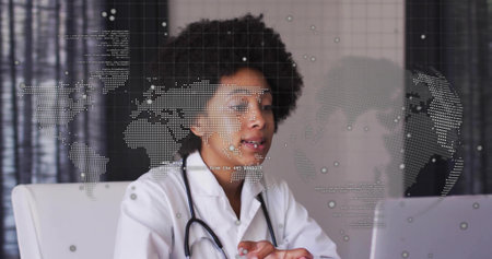 Presenting doctor sharing digital world map overlay at medical office, with stethoscope and laptop. Medical, professional, technology, data, consultation, innovation, corporateの写真素材