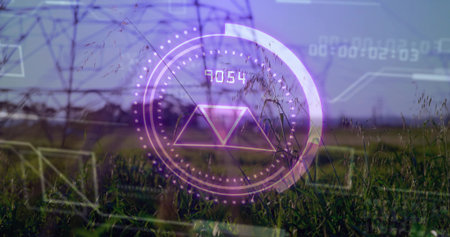Displaying purple HUD overlaying grassland with pylons, round gauge, triangle and numeric readout. Futuristic, technology, infrastructure, digital, landscape, innovation, data visualizationの写真素材