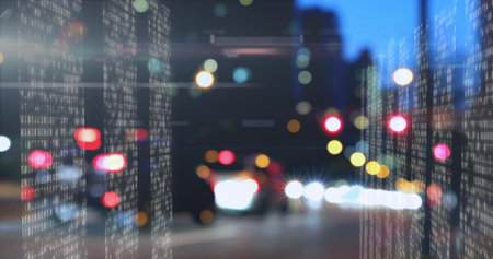 Overlaying vertical white binary streams illuminating city street at night, blurred vehicle lights. Futuristic, cyberpunk, neon, technology, data, motion, urbanの写真素材