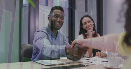 Leaning manager and HR rep exchanging handshake at meeting table with clipboard and charts overlay. Professional, collaboration, modern, corporate, teamwork, innovation, businessの写真素材
