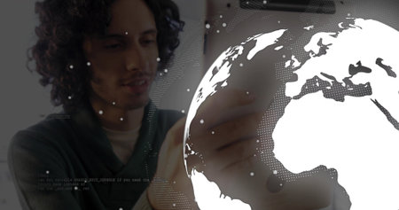 Tapping tablet White male wearing sweater using holographic map interface at office, copy space....