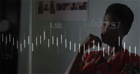 Woman wearing orange blouse studying waveform overlay in home office, with numeric data, copy space....