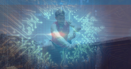 Leaning man wearing red top over wood railing in forest, with circuit overlay. Adventure, wellness, vitality, outdoor, natureの写真素材