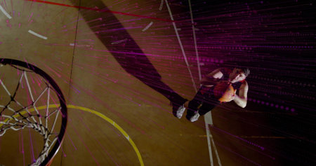 Athlete holding basketball at free throw line court, with hoop net and digital streaks, copy space....