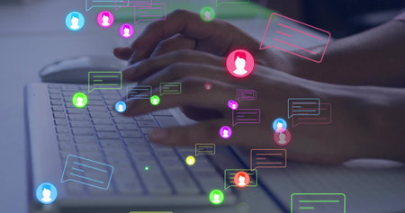 Typing female hands pressing keys on laptop keyboard at desk, with chat bubbles and avatar icons. Technology, communication, digital, workspace, modern, interface, collaborationの写真素材