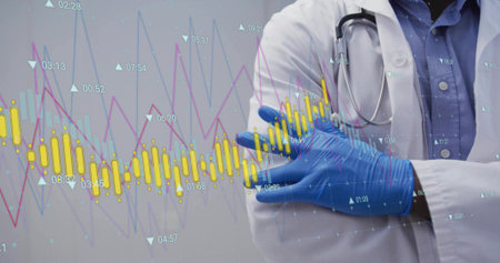 Standing doctor wearing white coat folding arms at clinic, stethoscope, gloves, charts, copy space. Medical professional, healthcare, clinical analysis, data visualization, diagnostic tools, health technology, professional attireの写真素材