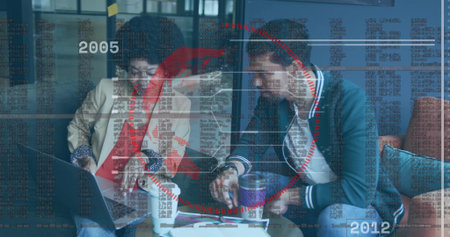 Collaborating colleagues discussing code and charts on laptop at office lounge, holding coffee mugs. Innovation, teamwork, creativity, modern, professional, digital, productivityの写真素材