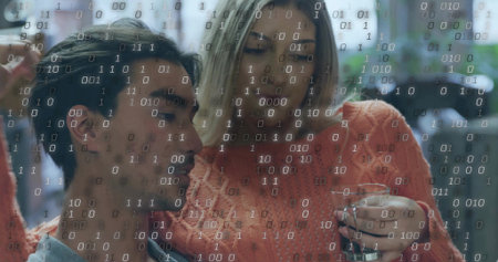 Sitting Asian man and White woman in cafe lounge, with clear glass and binary code overlay....