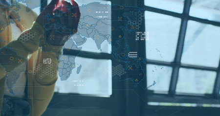 Pressing pointer with red work glove on map interface with overlays in command center, copy space....