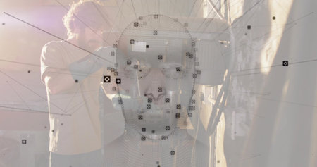 Displaying 3D mesh head in tech studio, with technician wearing tshirt and jeans adjusting scanner. Digital, futuristic, industrial, innovation, engineering, technology, visualizationの写真素材