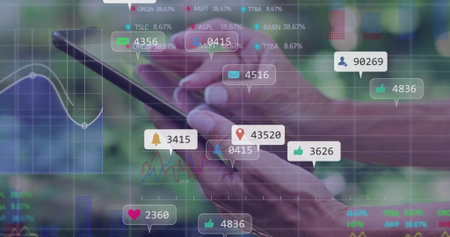 Displaying wrinkled hands tapping smartphone screen in garden, with social icons and charts. Technology, analytics, data, innovation, outdoors, transparency, communicationの写真素材